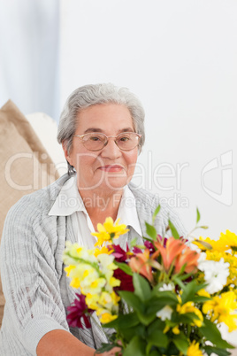 Senior woman with flowers