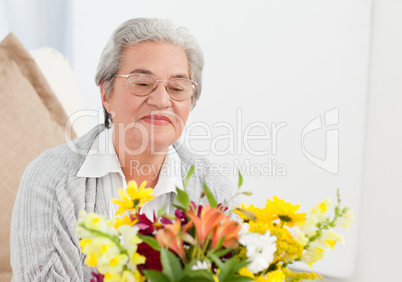 Senior woman with flowers