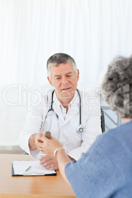 A senior doctor with his patient A senior doctor with his patient