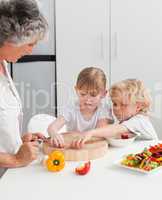 Children cooking with grandmother