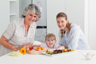 Family cooking together in the kitchen at home