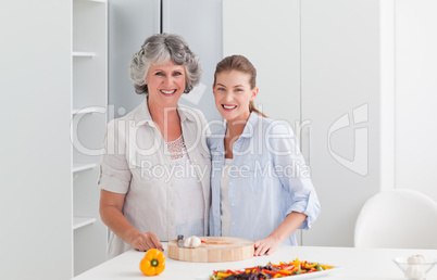 Woman cooking with her mother at home