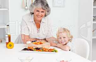 Boy and his grandmother looking at the camera