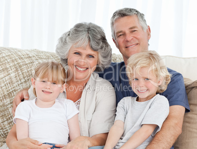 Joyful family looking at the camera