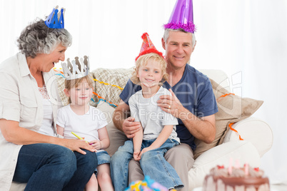 Happy family looking at the camera on a birthday