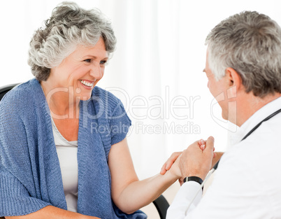 A senior doctor doing an examination of his patient