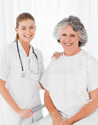 Senior with her nurse looking at the camera