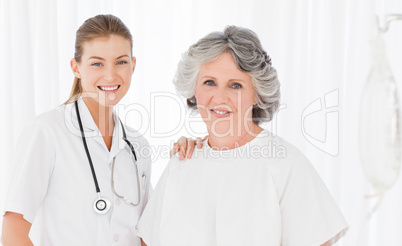 Senior with her nurse looking at the camera