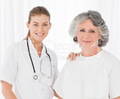 Senior with her nurse looking at the camera