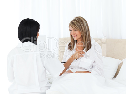 Mature woman talking with her nurse