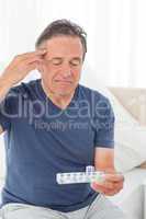 Sick man taking his pills
