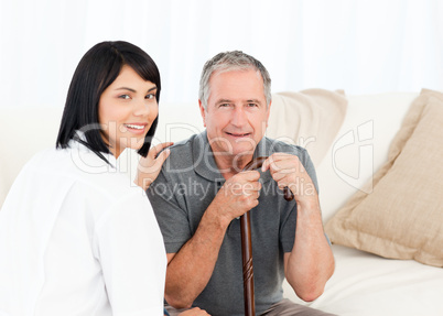 Nurse with her patient looking at the camera