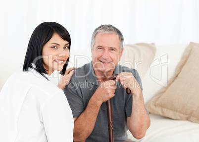 Nurse with her patient looking at the camera