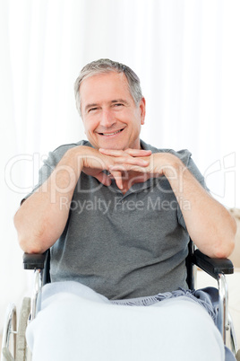 Man on his wheelchair looking at the camera