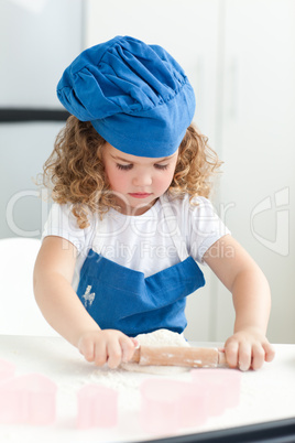 Little girl baking in the kitchen