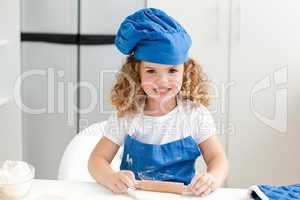 Little girl baking in the kitchen