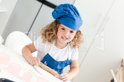 Little girl baking in the kitchen