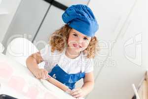 Little girl baking in the kitchen