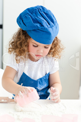 Little girl baking in the kitchen