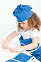 Little girl baking in the kitchen