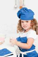 Little girl baking in the kitchen