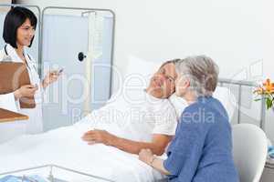 Nurse with a couple in a hospital