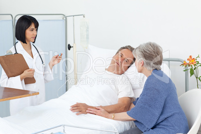 Nurse with a couple in a hospital