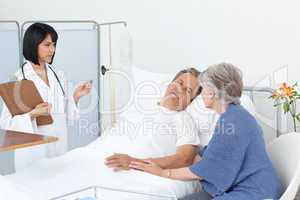 Nurse with a couple in a hospital