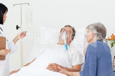 Nurse with a couple in a hospital