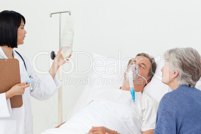 Nurse with a couple in a hospital