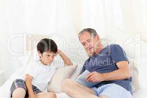 Young boy listening his grandfather
