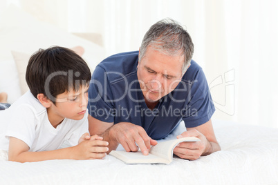 Young boy listening his grandfather