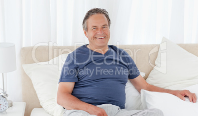 Man  lying down on his bed