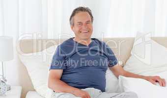 Man  lying down on his bed