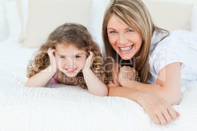 Little girl with her grandmother looking at the camera