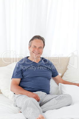 Man  lying down on his bed