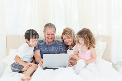 Family looking at their laptop