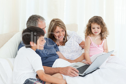 Family looking at their laptop