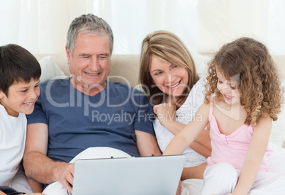 Family looking at their laptop