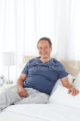 Man  lying down on his bed