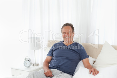 Man  lying down on his bed