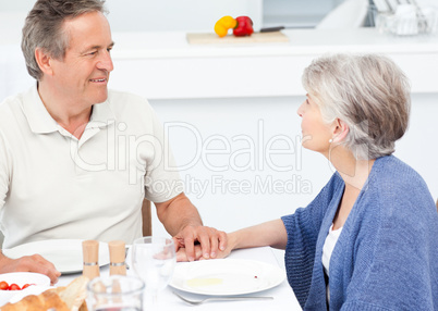 Retired couple eating  in the kitchen