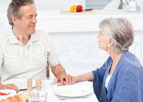 Retired couple eating  in the kitchen