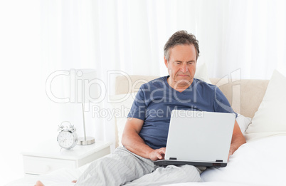 Man looking at his laptop