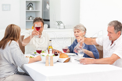 Mature friends taking lunch together