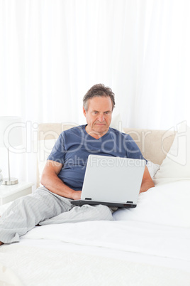 Man looking at his laptop