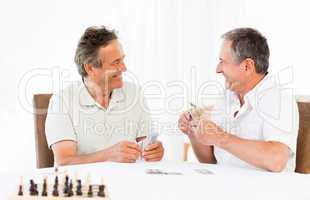 Men playing cards on the table