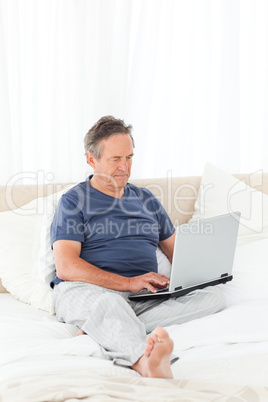 Man looking at his laptop