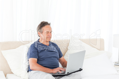 Man looking at his laptop