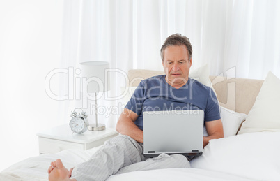 Man looking at his laptop